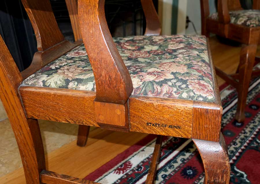 photo detail of 1087 Armchair, purchased by Cass Gilbert for the 1905 Minnesota State Capitol, carved wood with fabric cushion seat cover, pair located in South St, Paul, Minnesota
