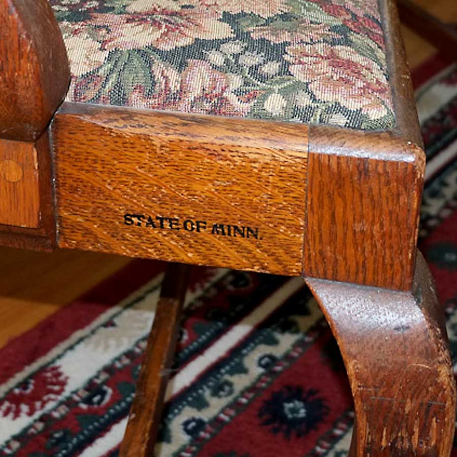 photo detail of 1087 Armchair, purchased by Cass Gilbert for the 1905 Minnesota State Capitol, carved wood with fabric cushion seat cover, pair located in South St, Paul, Minnesota