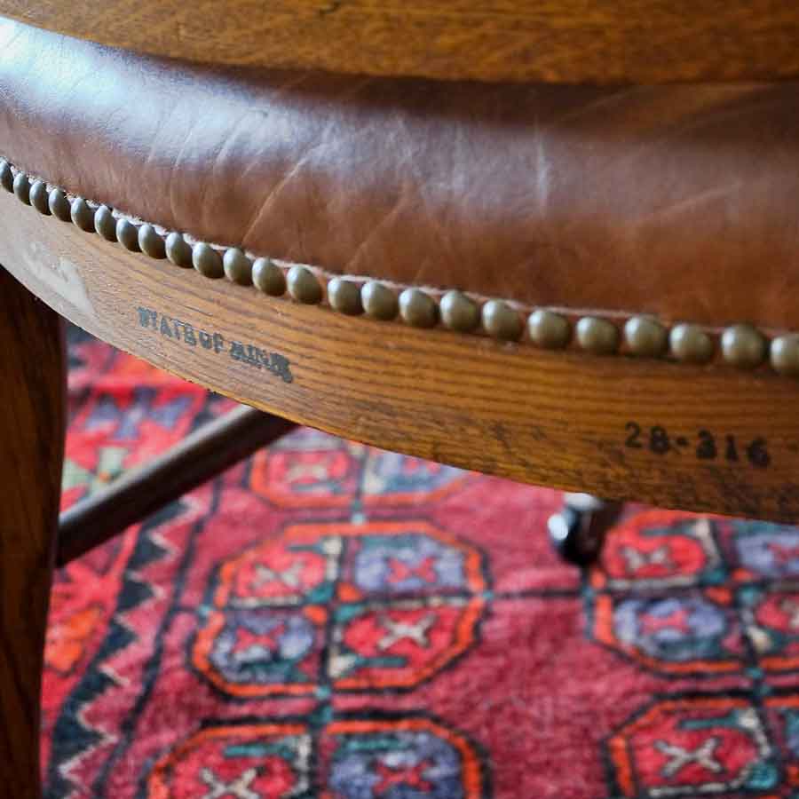 Detail of 573 Armchair, purchased by Cass Gilbertfor the 1905 Minnesota State Capitol, carved wood with leather cushion on seat and back