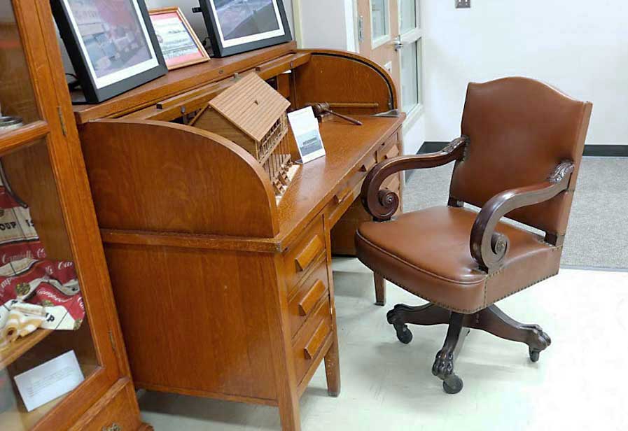 photo of DD Swivel Chair designed by Cass Gilbert for the 1905 Minnesota State Capitol, carved wood, covered with leather