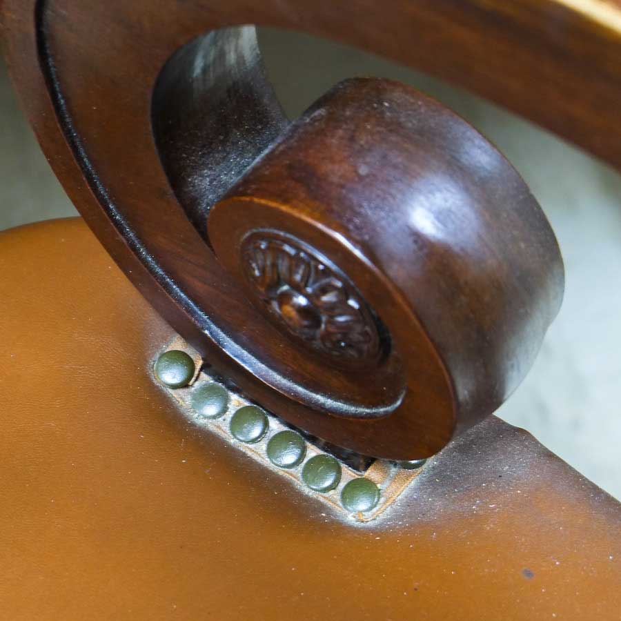 photo of closeup of arm of DD Swivel Chair designed by Cass Gilbert for the 1905 Minnesota State Capitol, now in Nobles County Historical Society