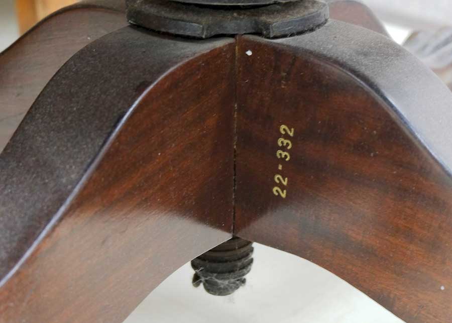 photo detail of identification mark on DD Swivel Chair designed by Cass Gilbert for the 1905 Minnesota State Capitol, now in Nobles County Historical Society