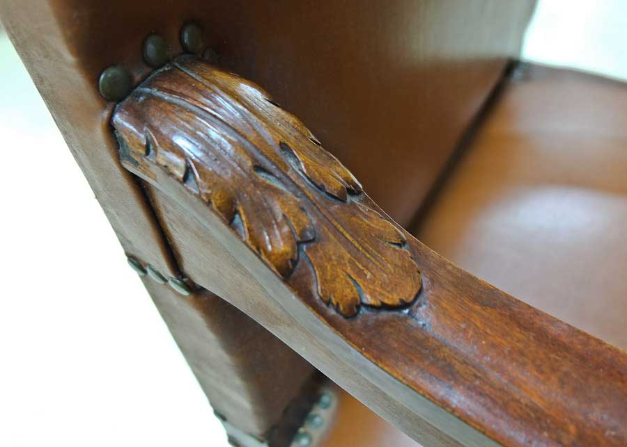 photo close up of carved detail of arm of DD Swivel Chair designed by Cass Gilbert for the 1905 Minnesota State Capitol, now in Nobles County Historical Society