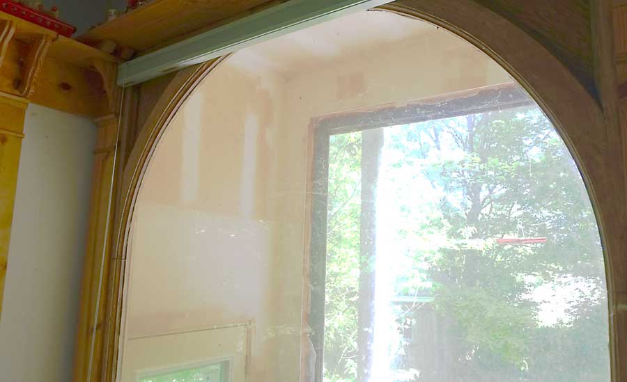 photo of re-used original window, designed by Cass Gilbert for the 1905 Minnesota State Capitol, milled wood and glass